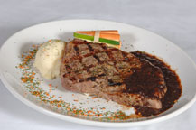 grilled steak served at sancho panza wine bistro and jazz club restaurant in cabo san lucas, mexico