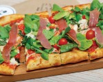 Photo: - page 51 | Carlos Aboyo – Caption: The rectangular-shaped pizzas at Pan di Bacco are quickly becoming a favorite