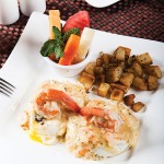 Photo.- page 67 | Francisco Estrada – Caption: The eggs Benedict with shrimp is one of our favorites from Solomon's Landing.