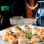 Photo.- page 94 | Francisco Estrada – Caption: The sushi menu at Solomon's Landing includes this salmon roll with special sauce.