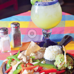 Photo.- page 78 | Andrik Oechler – Caption: It's all about the chicken fajitas at El Coral in Cabo san Lucas