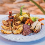 Photo.- page 86 | CaboPictures.com – Caption: Los Barriles offers a bountiful surf and turf platter