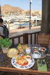     Photo:  - page 83 | Miguel Ventura     Caption: The Huarache de Tacho     at Los Deseos is made with steak     on a sope and served with homemade     sauce and melted cheese.