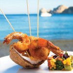 Photo: - page 56 | Francisco Estrada • Caption: The coconut shrimp at Baja Cantina Beach comes with a side of vegetables as well as an excellent view of the bay.