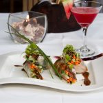 Photo.- page 84 | Miguel Ventura – Caption: La Panga Antigua fuses flavors with this shrimp spring role citrus tamarind sauce.