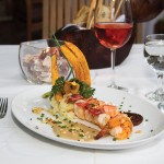 Photo.- page 86 | Miguel Ventura – Caption:Black and white moles are served alongside jumbo shrimp at La Panga Antigua