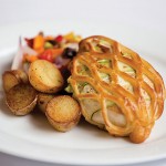 Photo.- page 92 |CaboPictures.com – Caption: Bacon and zucchini wrap a tender chicken breast, which is them baked in a puff pastry at Romeo & Julieta.