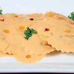 Photo.- page 92 | Miguel Ventura – Caption: A cream souce and chile oil pair perfectly with the ravioli at Romeo & Julieta.