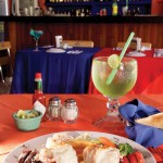 Photo.- page 94 | Gilda Badillo – Caption: The Shrimp Factory may be known, as you would expect given its name, for shrimp, but its lobster options are fantastic. The simple steamed lobster with butter is a winner.