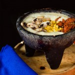 María Corona Cheese Fondue.- cheese fondue prepared at your table with mushroom and chorizo (spicy sausage) served with salsas and handmade tortillas