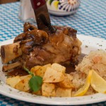  Pork Hock grilled, slow oven baked served with house made sauerkraut and pan fried potatoes. 