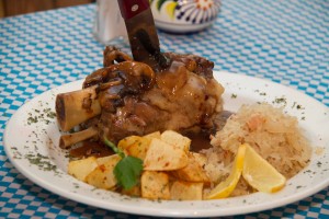  Pork Hock grilled, slow oven baked served with house made sauerkraut and pan fried potatoes. 