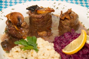 Beef Roulade, lean beef stuffed with bacon, pickles and onions with a rich gravy served with house made red cabbage and spätzle (German pasta).  