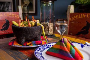 LAVA STONE MOLCAJETE.- Delicious baked & grill dish served with Nopal scallions, panela cheese, avocado and chicken
