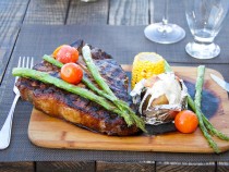 Grilled Porter House.- with baked potato and braised vegetables