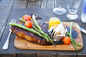 Grilled Porter House.- with baked potato and braised vegetables
