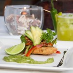 Tlacoyo Filled with Requesón and topped with home made smoked fish, cilantro, avocado, red onion and green tomato and chilli pepper sauce.