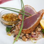 Seared Tuna.- crusted with pumpkin seed & dry chillis accompanied with oriental salad with soy & peanuts vinaigrette.