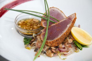 Seared Tuna.- crusted with pumpkin seed & dry chillis accompanied with oriental salad with soy & peanuts vinaigrette.