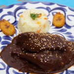 Mole Poblano.- Masterpiece of the Mexican cuisine savory dish of chicken covered in a rich sauce of dried ancho, mulato & pasilla peppers; a multitude of seeds, spices & a hint of chocolate. (approx. 35 ingredients) A feast for your palate!