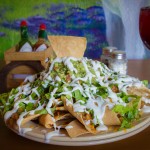 Big Ass Nachos: Two layers of chips with chili, beans and cheese toped with guacamole.