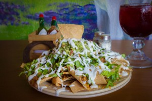 Big Ass Nachos: Two layers of chips with chili, beans and cheese toped with guacamole.