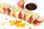 Photo: - page 64 | Francisco Estrada – Caption: This Baja Cantina Beach sushi preparation features tuna and crab with yellow pepper and curry covered with lime wedges.