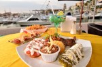 Enchilada, pot roast, stuffed poblano chile served with rice, beans and guacamole.