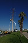 Two CFE teams work on repairing lines on Highway 1 near Soriana Plaza, Cabo San Lucas