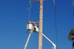 Two CFE teams work on repairing lines on Highway 1 near Soriana Plaza, Cabo San Lucas