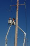 Two CFE teams work on repairing lines on Highway 1 near Soriana Plaza, Cabo San Lucas