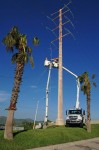 Two CFE teams work on repairing lines on Highway 1 near Soriana Plaza, Cabo San Lucas