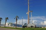 Two CFE teams work on repairing lines on Highway 1 near Soriana Plaza, Cabo San Lucas