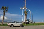 Two CFE teams work on repairing lines on Highway 1 near Soriana Plaza, Cabo San Lucas