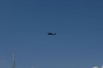 Policia Federal helicopter flying over the Cabo San Lucas marina.
