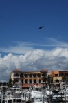 Policia Federal helicopter flying over the Cabo San Lucas marina.