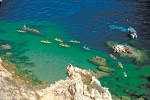 A kayaking tour takes adventures around Pelican Rock in Cabo San Lucas.